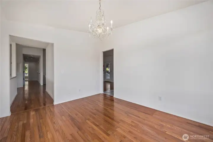 Formal dining room perfect for hosting with easy flow to kitchen and living spaces
