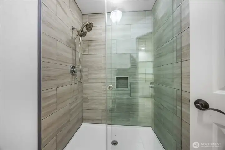 Tiled Upgraded Shower with Glass Door