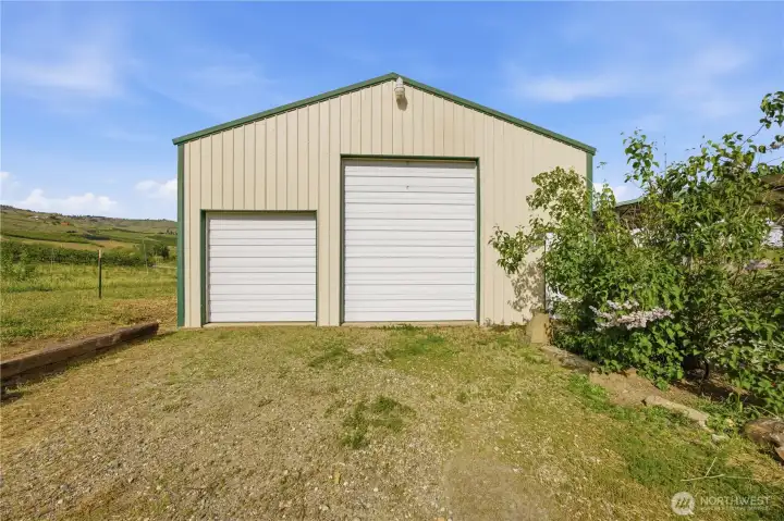 Detached shop with 12-ft door—ideal for equipment, hobbies, or workspace