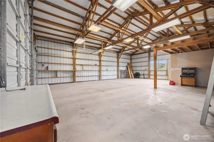 Detached shop with 12-ft door—ideal for equipment, hobbies, or workspace