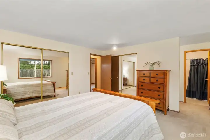 Master bedroom showing closet and bathroom
