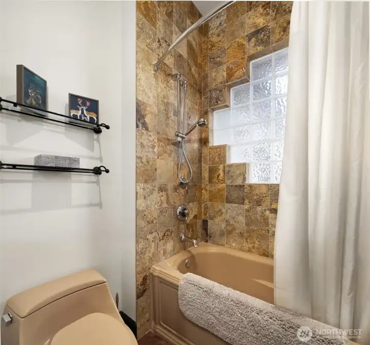 Second bathroom has shower/tub
