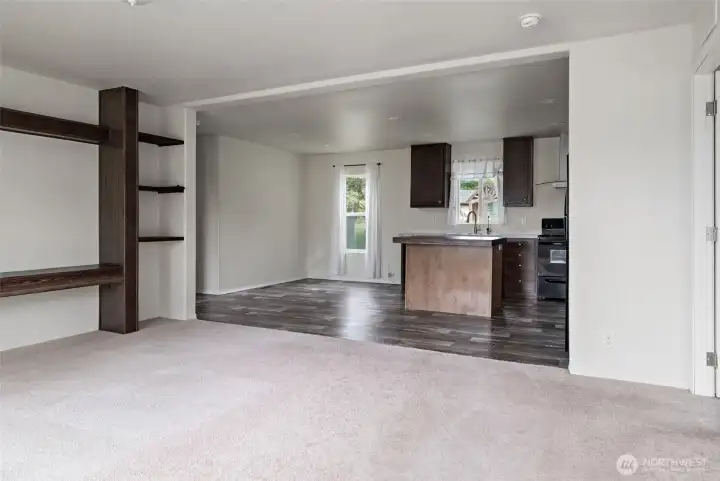 Open living room and kitchen design allows easy flow.