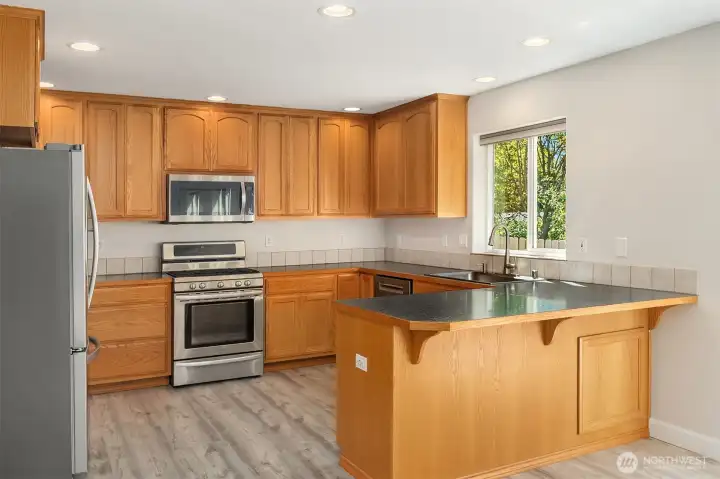 Chef's Kitchen Featuring Wood Cabinets - Breakfast Bar