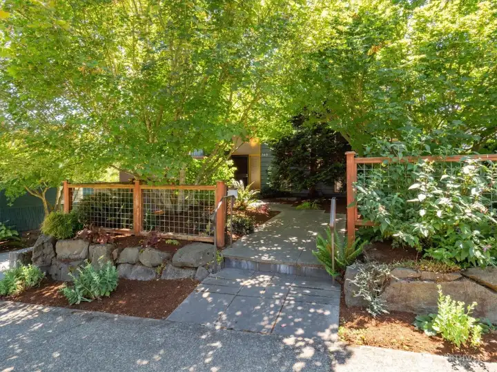 Located on a tree-lined street the front offers a mature and well tended display of greenery. Located on a tree-lined street the front offers a mature and well tended display of greenery.