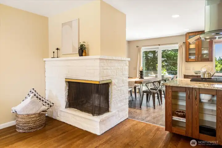 The open floor plan allows for great entertaining spaces and the corner fireplace adds a touch of mid century style. The open floor plan allows for great entertaining spaces and the corner fireplace adds a touch of mid century style.