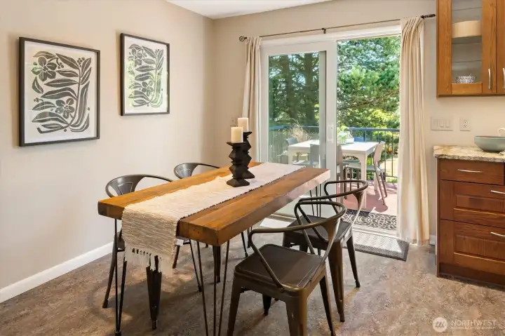 Sliders leading to the back deck offer the kitchen and dining area easy outdoor access. Sliders leading to the back deck offer the kitchen and dining area easy outdoor access.