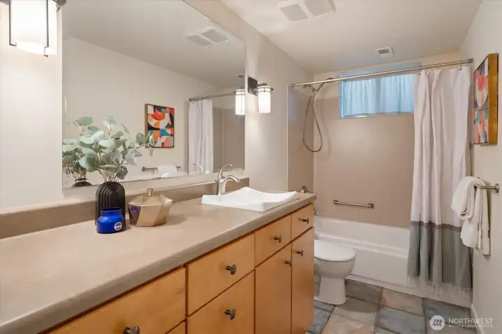 The lower level bathroom is a full bath with tiled floors and tons of space. The lower level bathroom is a full bath with tiled floors and tons of space.