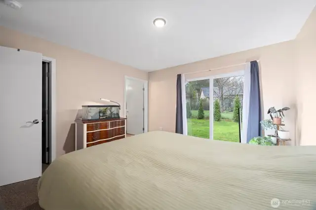 Primary bedroom with slider and entry to private Primary Bath