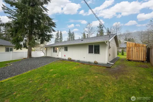 Front of house with 3 cord wood shed