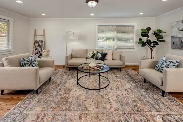 Step inside to discover gleaming hardwood floors and abundant natural light that flows through the thoughtfully designed layout.