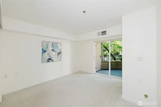 Spacious bedroom also has slider to deck