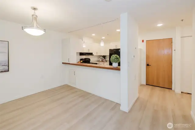 Extra storage on living room side of kitchen with pull-out drawers.