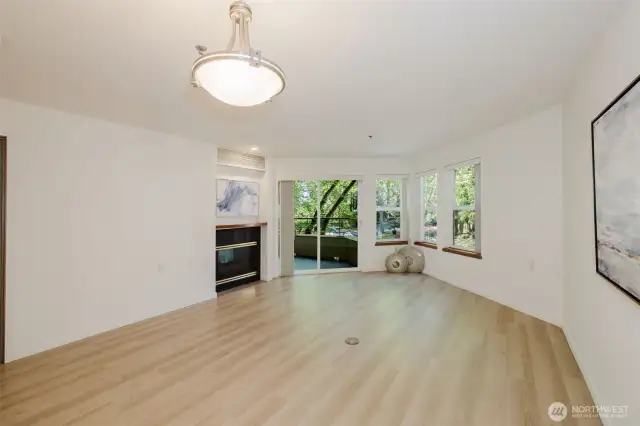 Gas fireplace. Slider leads to spacious deck overlooking lush grounds