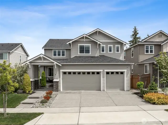Great curb appeal and nice wide driveway with sealed concrete and three car garage
