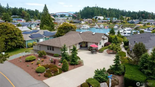 Waterfront home in Shelter Bay with gorgeous landscaping and plenty of parking.
