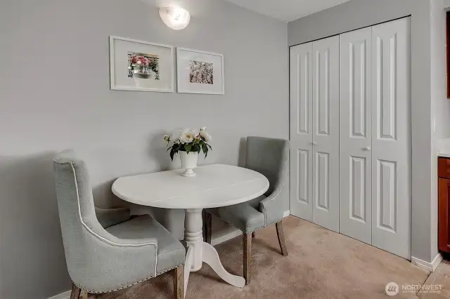 The closet near the kitchen is a utility room for the laundry and hot water heater
