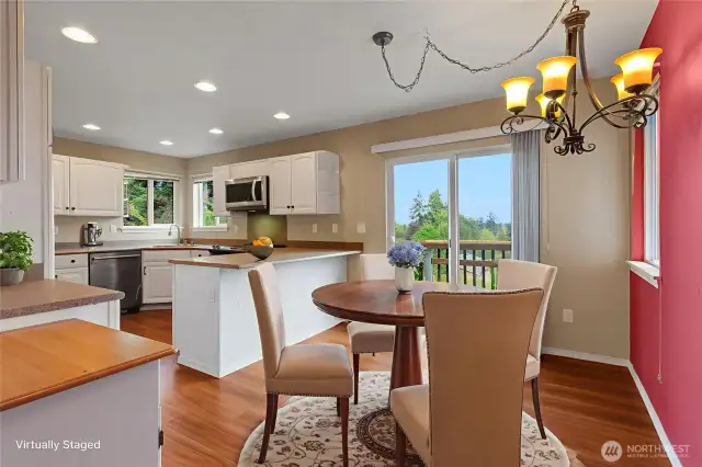 Kitchen & Dining room w/slider leading the upper deck (virtually staged)