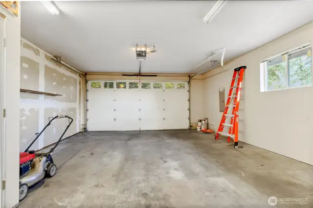 2 Bay Garage, door to left leads to additional storage and 3rd Bay