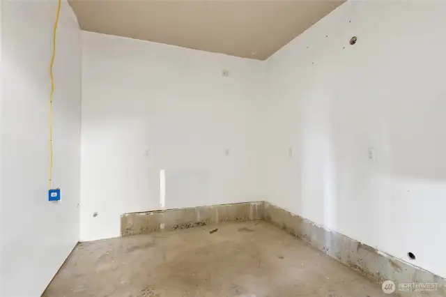Finished storage area between garage bays