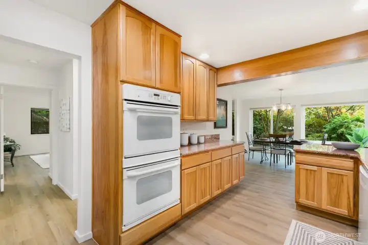 Open sight lines from kitchen to dining area and private patio beyond.