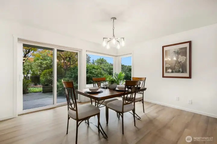 Dining area opens directly to private patio and garden space. Perfect indoor-outdoor flow.