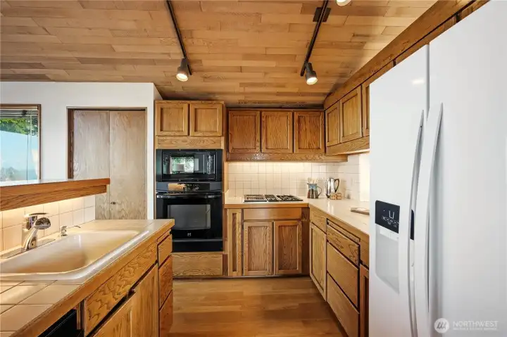 Kitchen, open to family room and pass-through to dining room