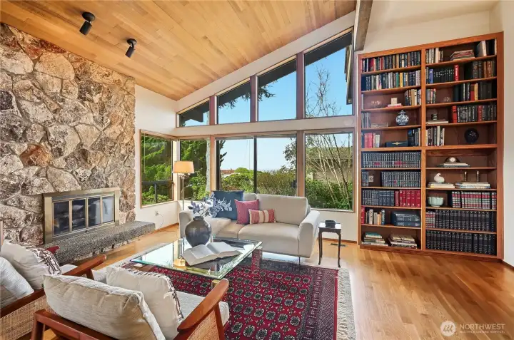 Entry level living room welcomes you with sliders to private patio and peek-a-boo view of the Sound