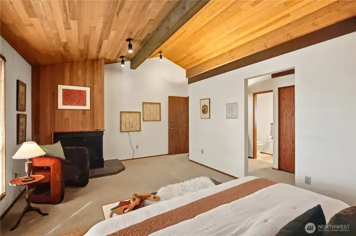 Fireplace anchors the primary suite with large 3/4 ensuite bath