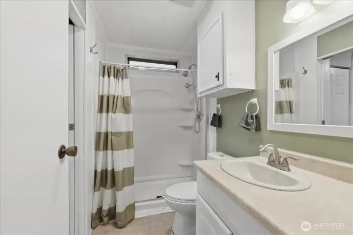 Main bath with access from 3 bedrooms and llaundry