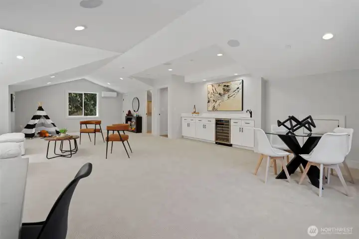 Welcome to your enormous Family Game Room. Above Beverage Bar is wired for your Big Screen. Sit back and enjoy a movie or time with loved ones.