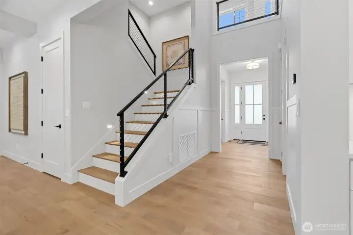Light fills the center of this home courtesy of windows on all levels. Time to head upstairs to the spacious and stunning Primary Suite, three more bedrooms and the laundry room on the Second Floor  .