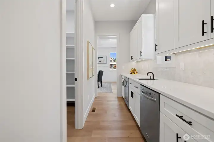 Butler's Pantry connecting Formal Dining room and Kitchen. Walk-In Pantry entrance from BP.