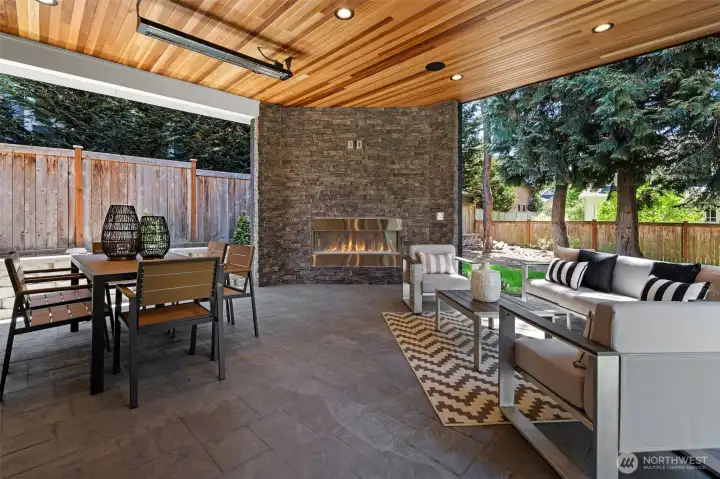 Enjoy outdoor entertaining all year round by the glowing gas fireplace.