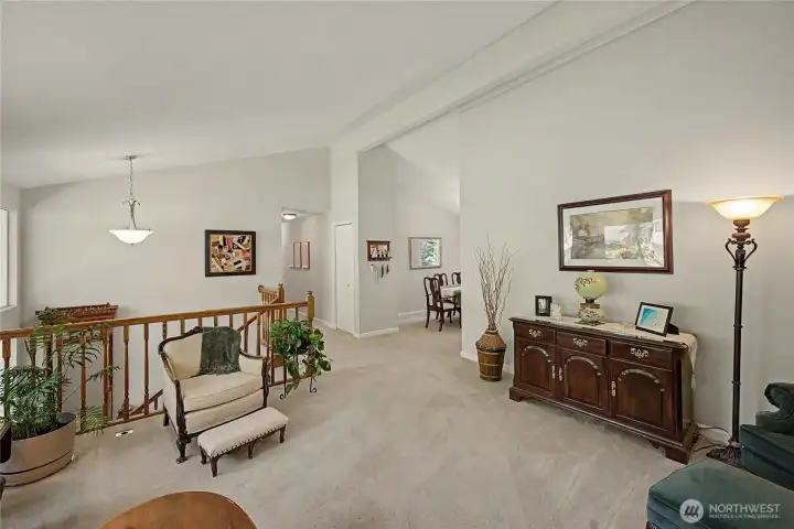 Living room with vaulted ceilings.
