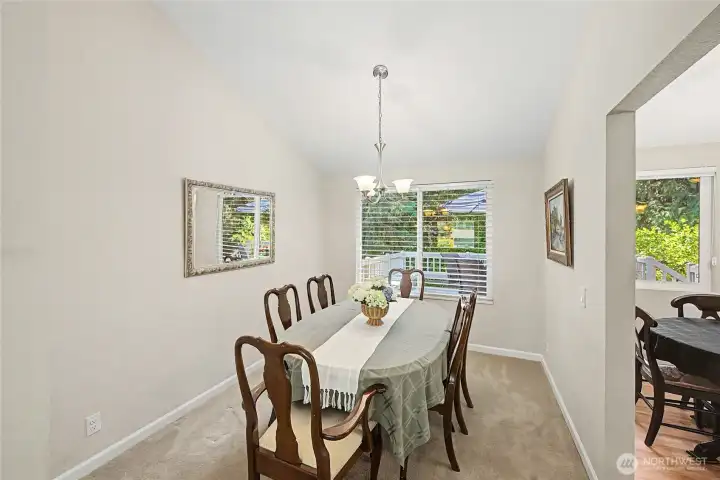 Dining room with vaulted ceilings.