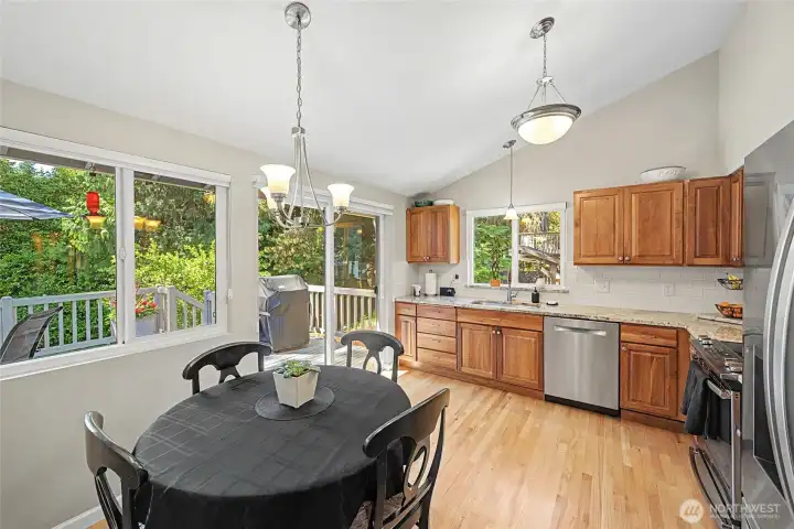 Kitchen with eating nook and hardwood floors.