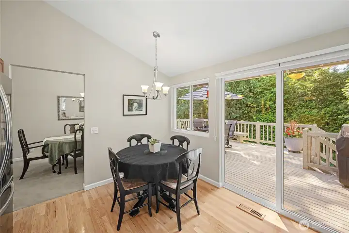 Breakfast nook in kitchen and access to the back deck.