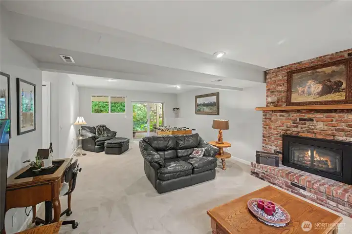 Large downstairs family room with gas fireplace.