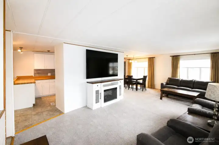 Large living room, brand new carpet, natural lighting