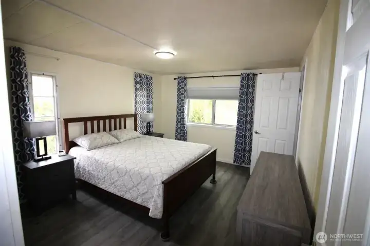 Master/Primary Bedroom - luxury vinyl plank flooring, walk in closet, 3/4 bath with shower