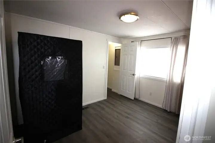 1 of 3 bedrooms, luxury vinyl plank flooring, walk in closet