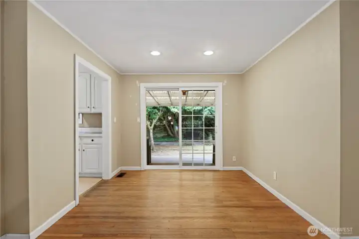 Dining area opens to the covered deck