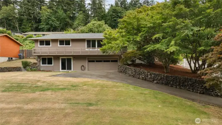 View capturing both stories of this wonderful home and mature landscaping. View capturing both stories of this wonderful home and mature landscaping.