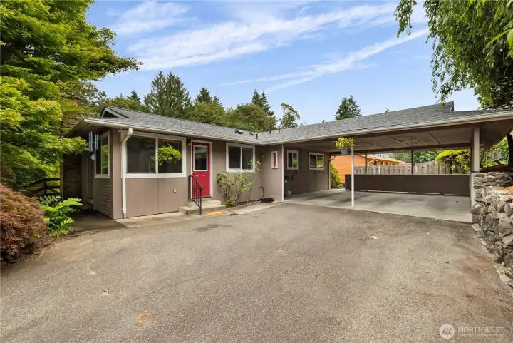 Upper level driveway leads right to the main level of home. Upper level driveway leads right to the main level of home.