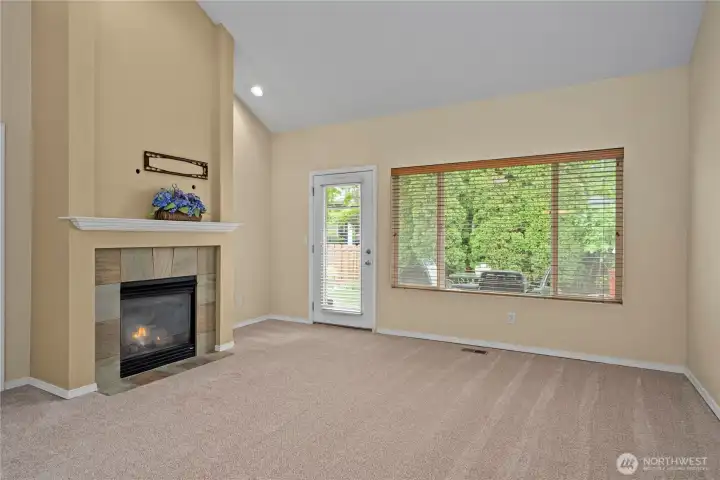 The living room looks out to the private backyard. The living room looks out to the private backyard.