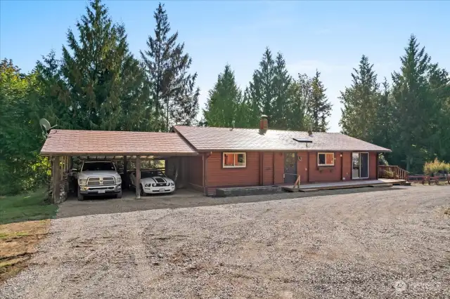 Charming copper roof daylight timber home has a formal entry on the right end of the home, and a wrap-a-round deck to view the horizon mountain view. Country Bliss!!