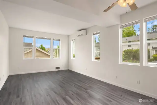 Living room with mini split and luxury vinyl flooring- perfect for pets!