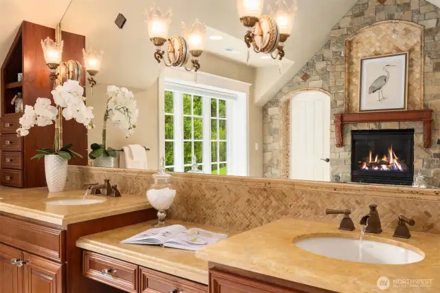 Dual vanities with makeup desk, stone accent wall with gas fireplace