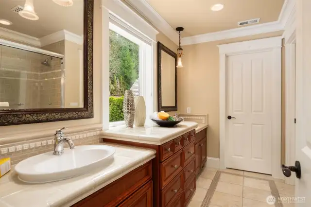 Secondary full bath with dual vanities and designer pendant lighting